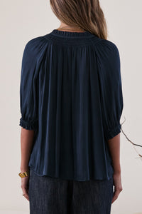 Blue Pleated V-Neck Blouse with Smocked Details
