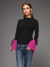 Black Knit Top with Pink Bell Sleeves and Bow Accents