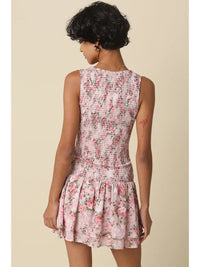 Smocked Floral Mini Dress with Ruffle Hem and Sleeveless V-Neck Design