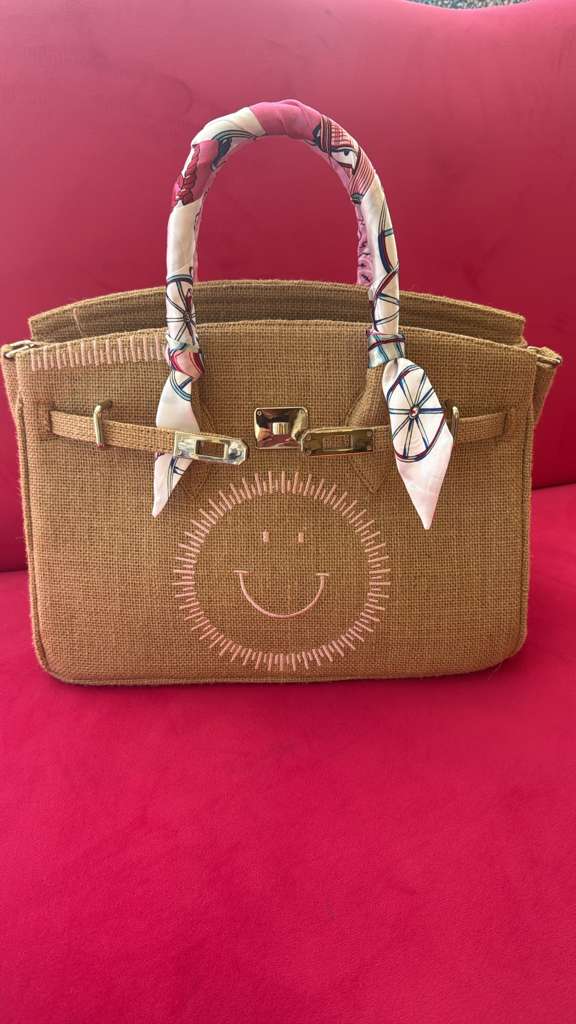 Woven Straw Tote Bag with Smiley Face Design and Silk Scarf Handle Accent
