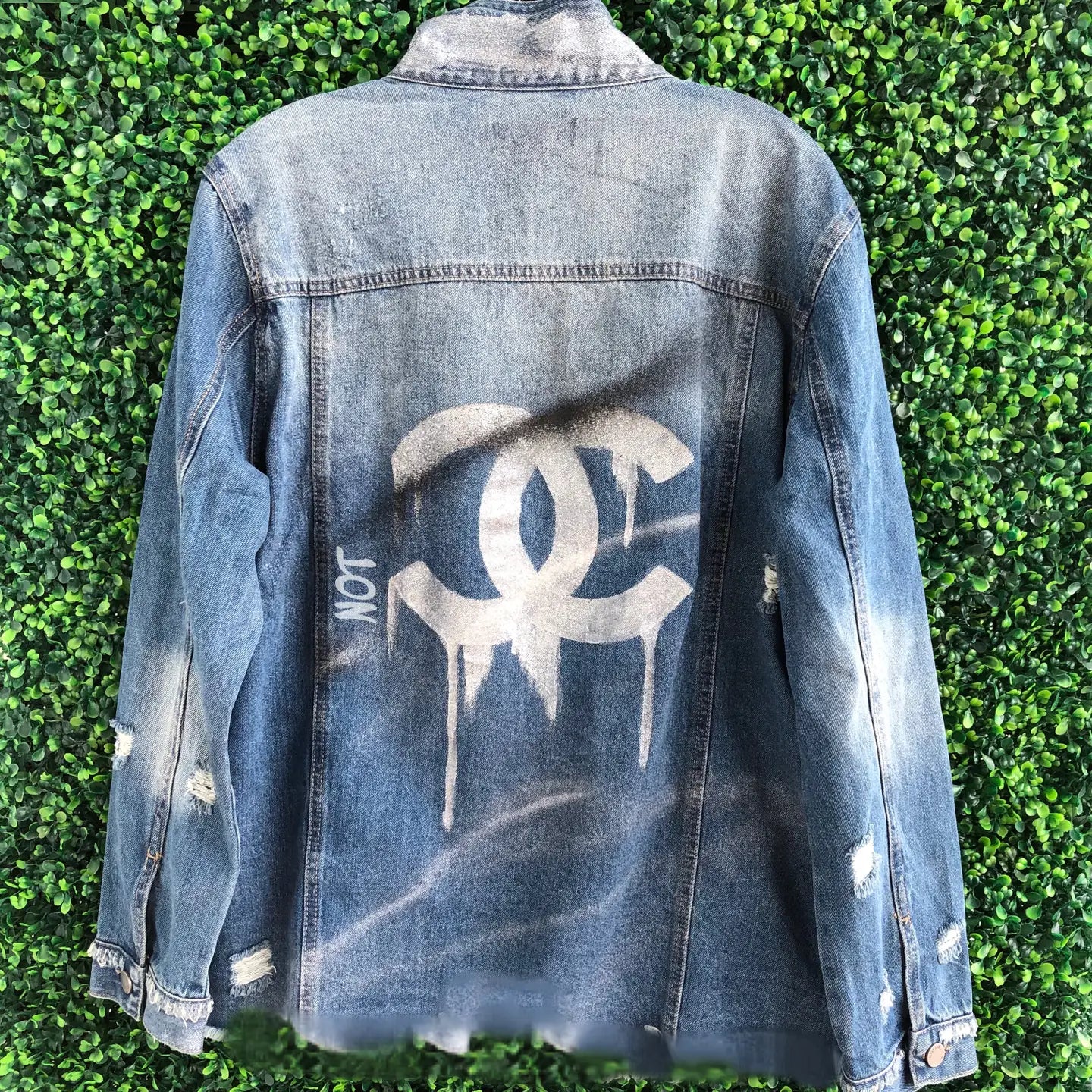 Distressed Denim Jacket with Hand-Painted Drip Logo Graphic