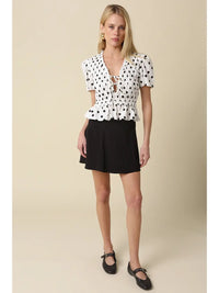 Polka Dot Smocked Peplum Top with Lace-Up Front and Puff Sleeves