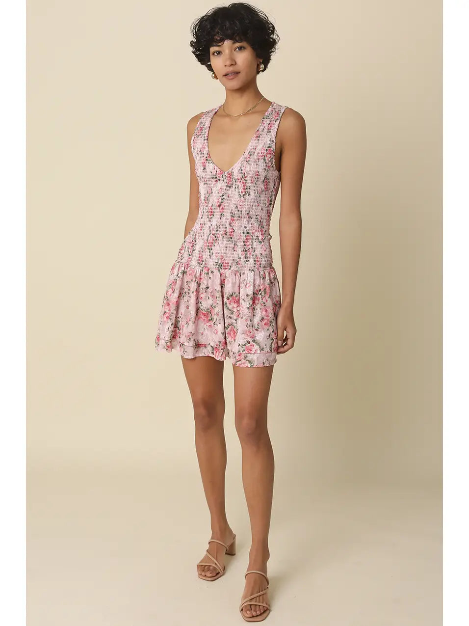 Smocked Floral Mini Dress with Ruffle Hem and Sleeveless V-Neck Design
